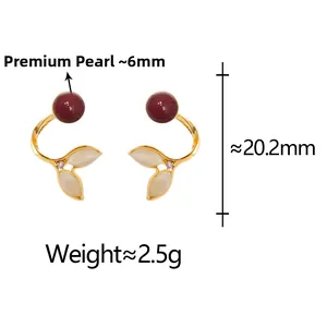 Detail of red pearl and cat eye stone fishtail earrings with technical size dimensions