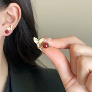 Elegant fishtail cat-eye stone earrings with red pearls and gold finish for women