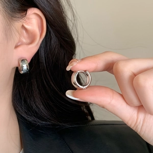 Minimalist silver thick hoop earrings in high-polished metal finish for women