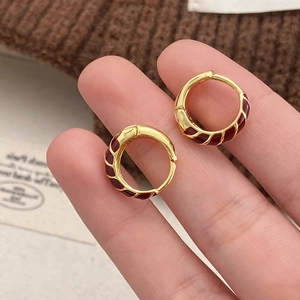 Minimalist gold-plated hoop earrings with dark red enamel spiral texture for women