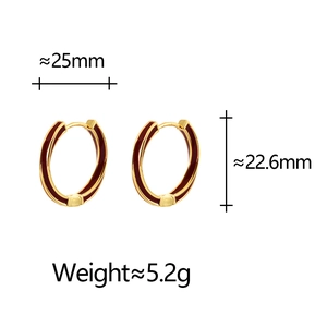 Detailed view of burgundy enamel hoop earrings with 25mm width and gold-plated finish