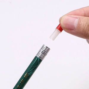 Macro detail of hand adjusting the red functional attachment on a 2.0mm 2B drafting pencil