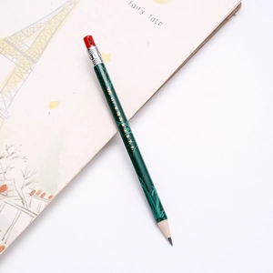 Green 2B drafting pencil with golden bamboo leaves on a white illustrated notebook