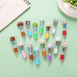Flat lay of 15 sports-themed multi-color retractable pens on a mint green background