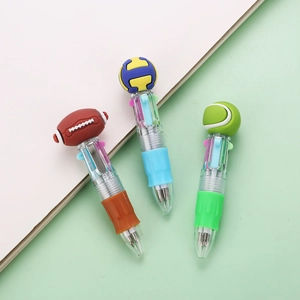 Detail of multi-color ballpoint pens with sports ball toppers and ergonomic soft grips