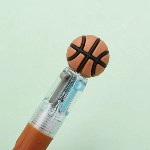 Close-up of a 4-color basketball pen showing the retractable multicolor ink mechanism