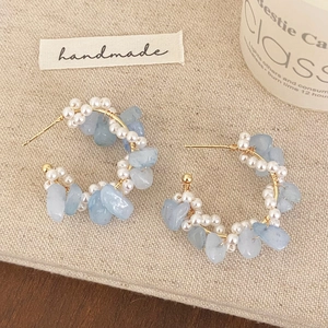 Handmade C-shape earrings with freshwater pearls and light blue crushed natural stones