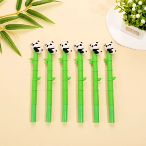 Detail of six green bamboo-shaped gel pens with cute 3D panda toppers for writing