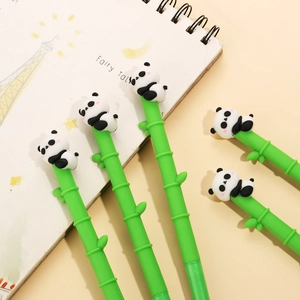 Close-up of five bamboo-shaped gel pens with cute silicone panda figures on top