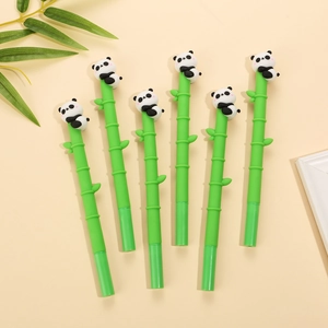 Detail shot of green bamboo-shaped gel pens with 3D cartoon panda tops on beige background