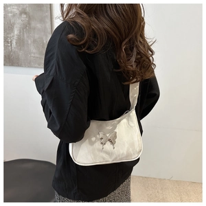 Detail of white underarm bag with silver butterfly buckle and marbled texture finish