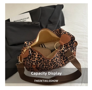 Spacious interior of a leopard print tote bag showing ample room for daily essentials