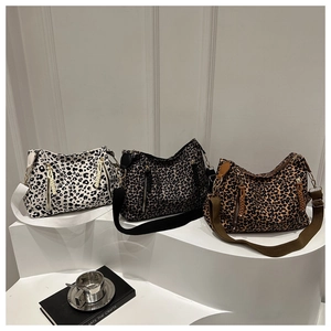 Three retro leopard print tote bags in white, grey, and brown with wide shoulder straps