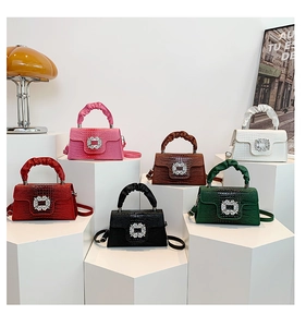 Detail of crocodile embossed mini bags with luxury crystal buckles in multiple colors