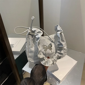 Silver metallic pleated cloud bag with butterfly buckle and ruffled edge detail