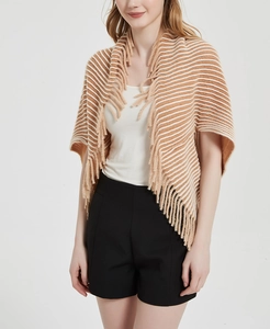 Close-up of brown and white striped knit shawl featuring elegant fringe detail texture