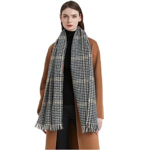 Classic black and white houndstooth scarf with fringe, stylish winter accessory for women