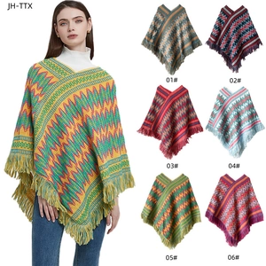 Ethnic knit poncho with geometric waves and fringe details in six various colors