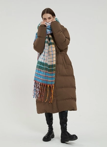 Close-up of rainbow plaid mohair scarf with thick fringe and blue-orange check patterns