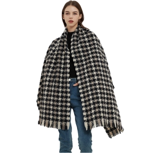 Classic black and white oversized houndstooth scarf with elegant tassel edges