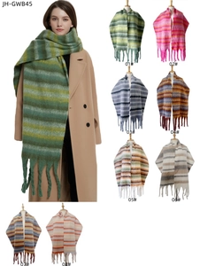 Detail showing oversized striped plush scarves with chunky tassels in eight colorways