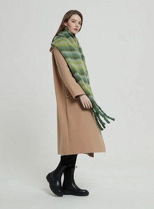 Winter chunky striped scarf with long tassels paired with a stylish camel wool coat