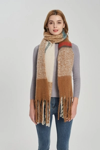 Close-up of thick checkered knit scarf with tassels and colorful mohair texture