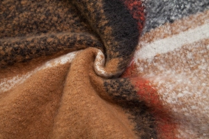 Macro detail of thick checkered scarf fabric with soft faux mohair fuzzy texture