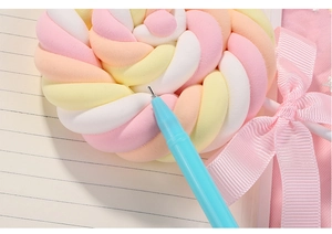 Close-up of needle-tip gel pen featuring a colorful marshmallow rabbit-ear topper