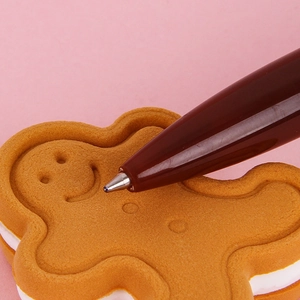 Penna a sfera a scatto creativa a forma di pan di zenzero con simpatico design cartoon
