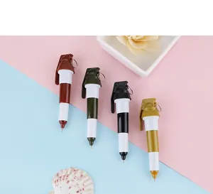Close-up of creative grenade-shaped ballpoint pens in four tactical colors on a pastel base