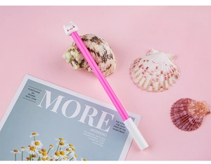 Detail of cute cat-themed gel pen with a 3D cartoon kitty topper and pink barrel