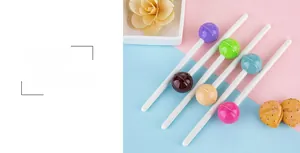 Close-up of creative lollipop-shaped gel pens in assorted candy colors for office and school