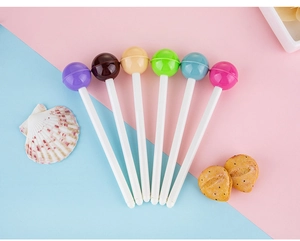 Detailed view of colorful lollipop shaped pens in purple, blue and pink pastel colors