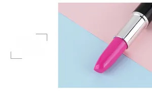 Macro detail of creative lipstick-shaped ballpoint pen featuring realistic red top and black base