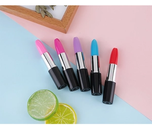 Lipstick-shaped ballpoint pens in five vibrant colors displayed on creative background