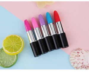 Creative lipstick-shaped ballpoint pens in five vibrant colors on a decorative background