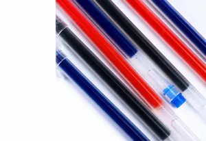 Close-up of large capacity red, blue, and black gel pen refills with sealing wax