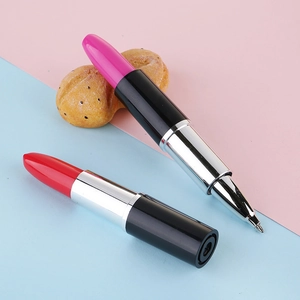 Creative lipstick shaped ballpoint pens in red and pink with removable caps