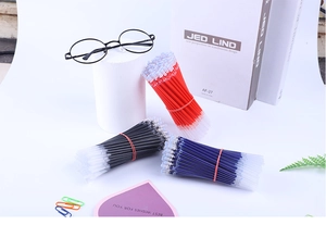 Close-up of 0.5mm gel pen refills in red, black, and blue sets on a desktop