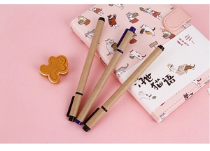 Pink cat notebook with kraft paper pens set for students on a soft pink background
