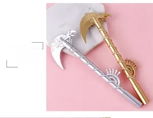 Detail of creative scythe-shaped gel pens in gold and silver with gear decorations
