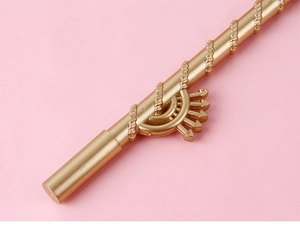 Macro detail of golden crescent wand showing intricate spiral patterns and metallic texture