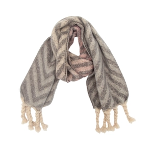 Detail of grey and beige herringbone knit scarf featuring chunky cream twisted tassels