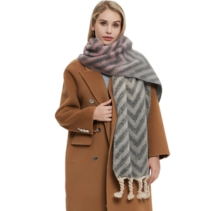 Thick autumn winter scarf with grey-pink chevron pattern and chunky braided tassels
