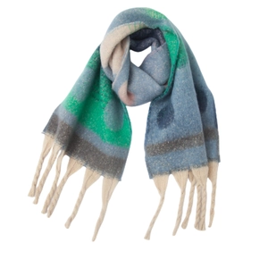Detailed view of colorful mohair shawl with thick tassels and gradient knit texture