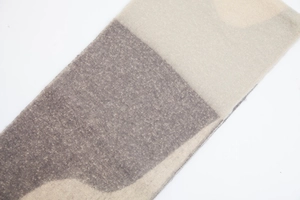 Detailed view of thick knit scarf with marble texture and premium yarn finish