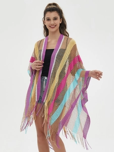 Detail of colorful striped crochet shawl featuring mesh knit texture and long fringe hem