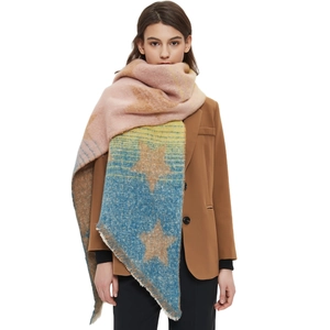 Chic knit star pattern shawl with tassels in pink and blue gradient on a model