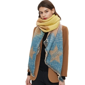 Warm chunky knit star pattern shawl with color gradient and fringed edges